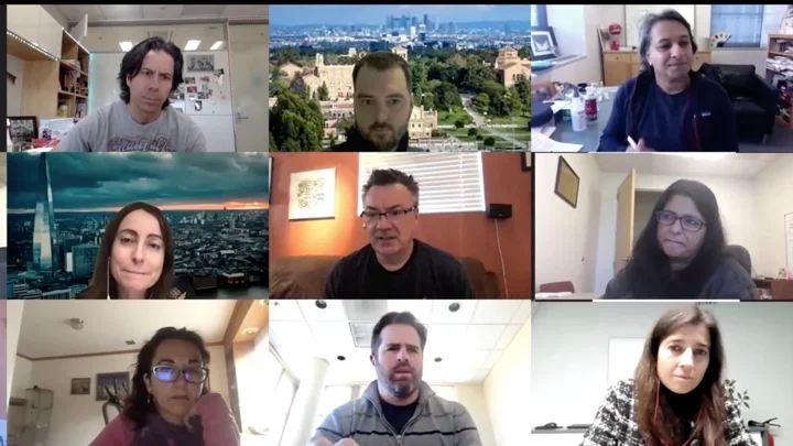 Video conference call featuring eight participants in a grid layout.