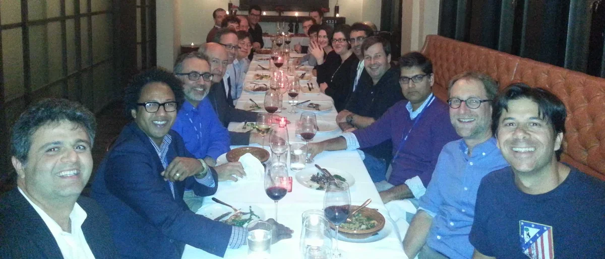 SFARI Group dinner in a warmly lit restaurant.