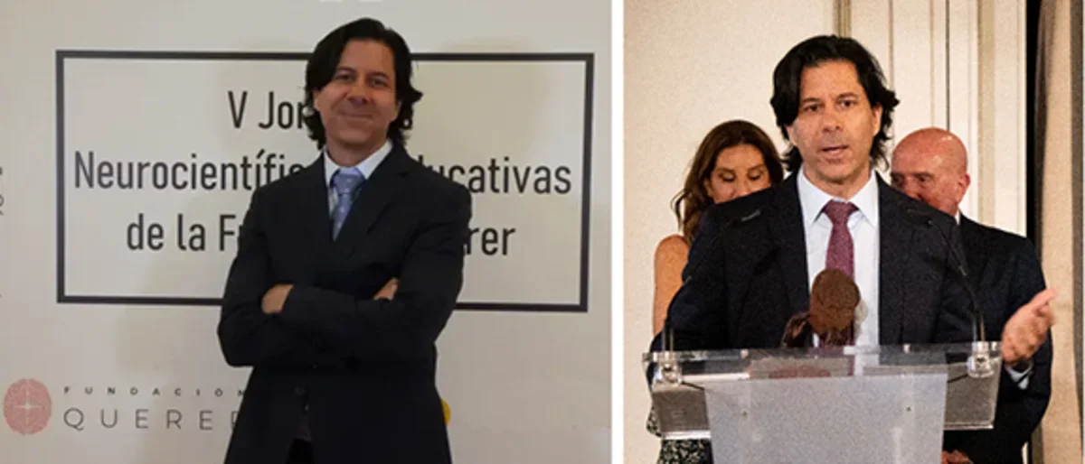 Dr. Portera-Cailliau in a suit and podium making a presentation at Querer conference. 