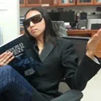 Cynthia He wearing sunglasses in lab.