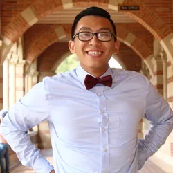 Michael Le in UCLA outdoor hallway.