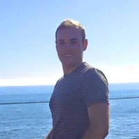 Peter Pellionisz in front of body of water