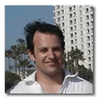 Rossen Badakov in front of building